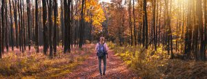woman standing in the forest autumn